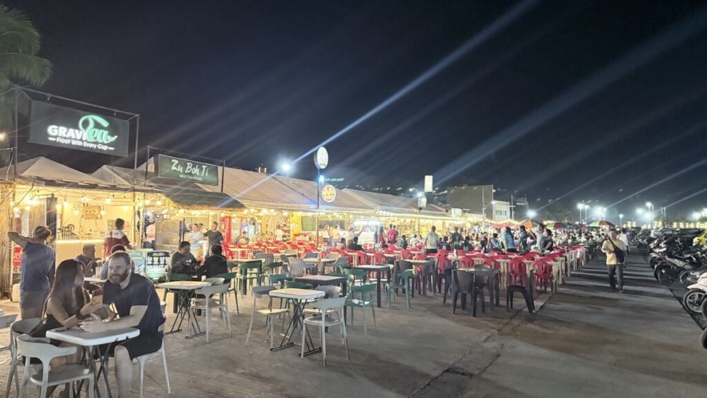 “ADTO TA SA PANTAWAN” 9 Food stalls and tables along Pantawan at night.
